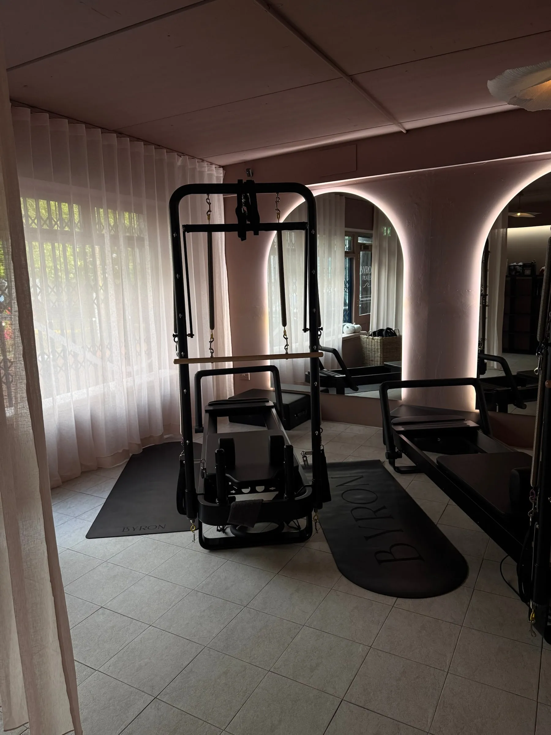 A tower reformer by the sheer-curtained window