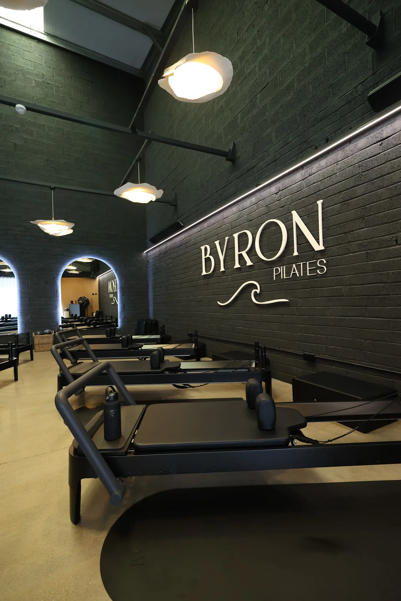 Reformers lined up beneath the illuminated BYRON wordmark in Kilcullen